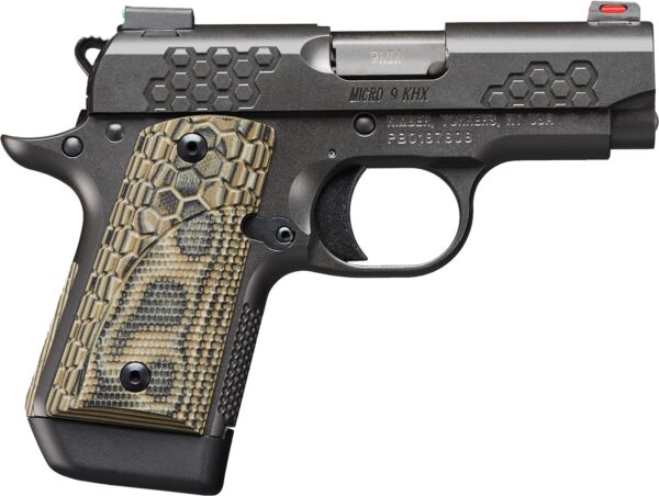 Black handgun with textured grip and hex pattern.