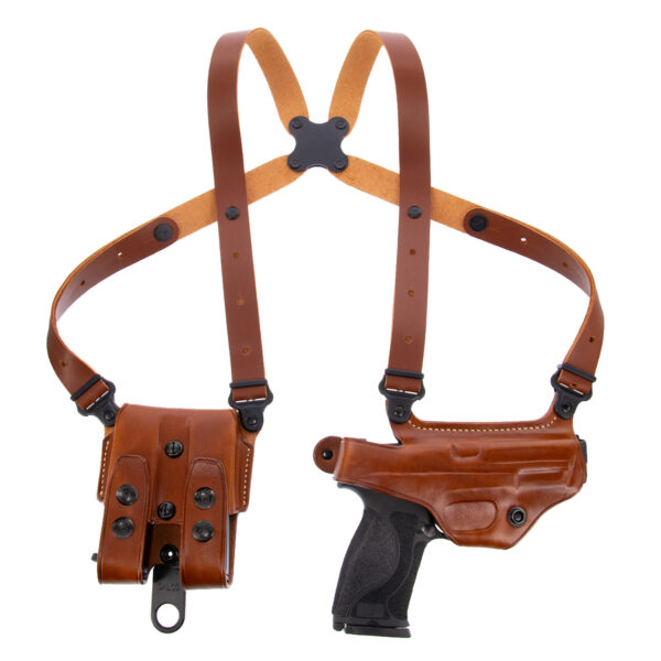 Brown leather shoulder holster with black gun.