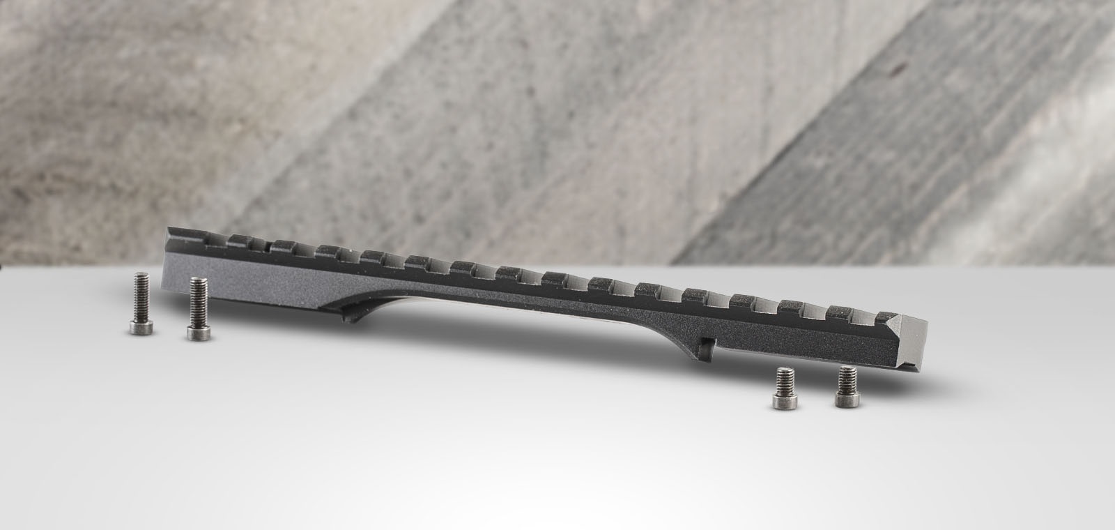 Picatinny rail and mounting screws on table