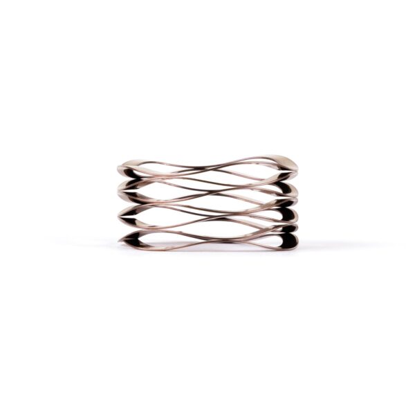 Sculptural silver bracelet with overlapping loops design.