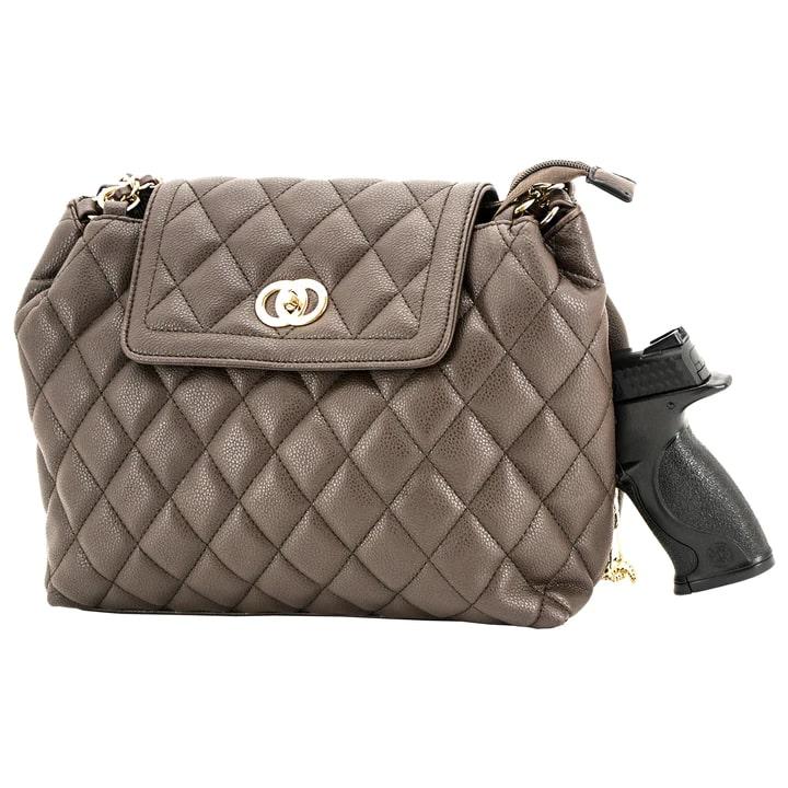 Quilted handbag with concealed handgun pocket.