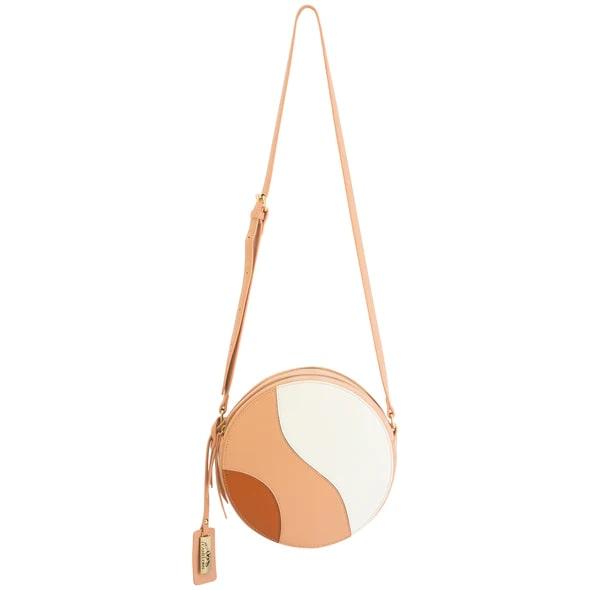 Round beige and white crossbody bag