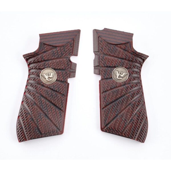 Wooden pistol grips with engraved pattern.