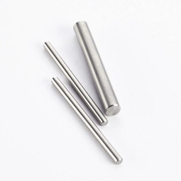 Three cylindrical metal rods on white background