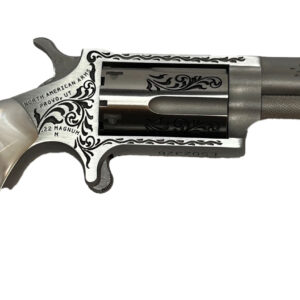 Silver revolver with decorative handle and engravings.