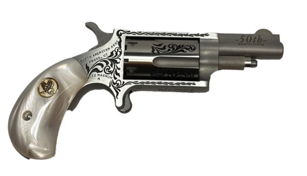 Silver revolver with decorative handle and engravings.