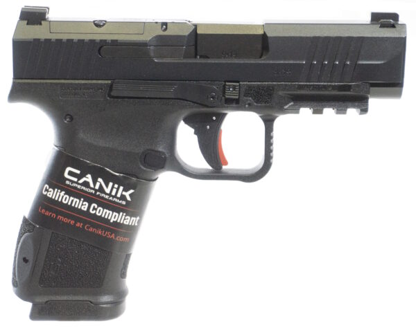 Handgun with compliance label and features visible.