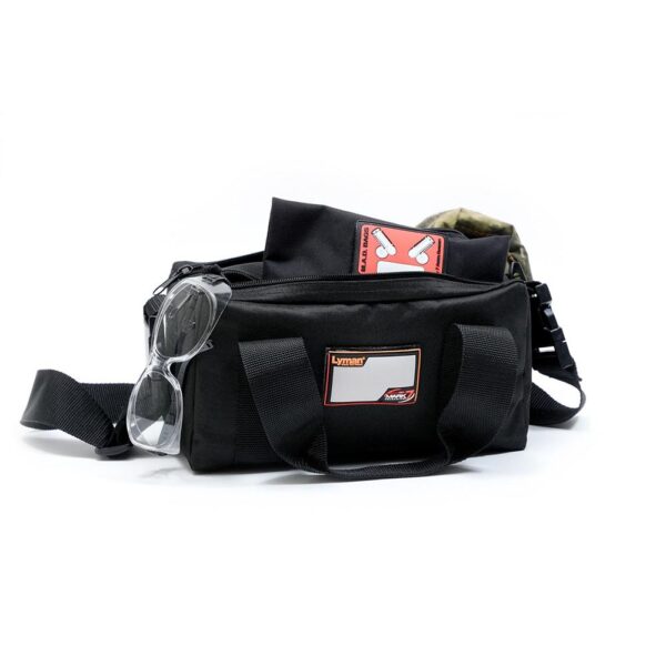 Black bag with glasses and accessories displayed.
