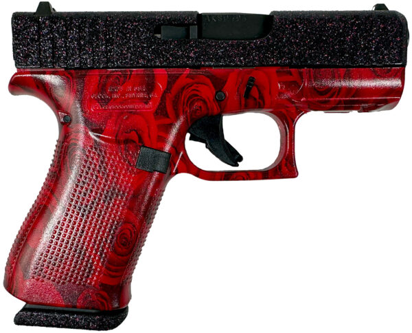 Red pistol with rose design and textured grip.