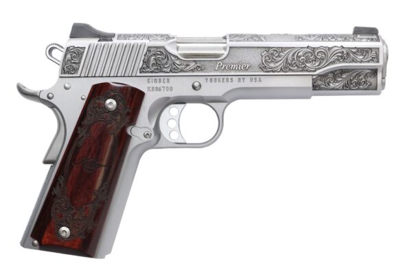 Intricately designed silver and wooden handgun