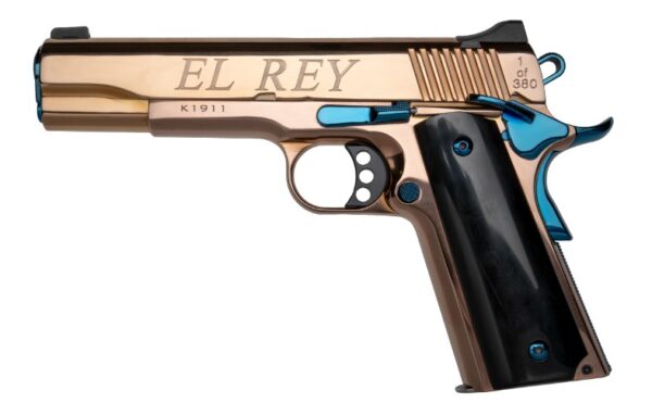 Bronze and black handgun with engraved text.