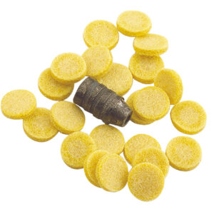 Yellow round tablets surrounding a gray object