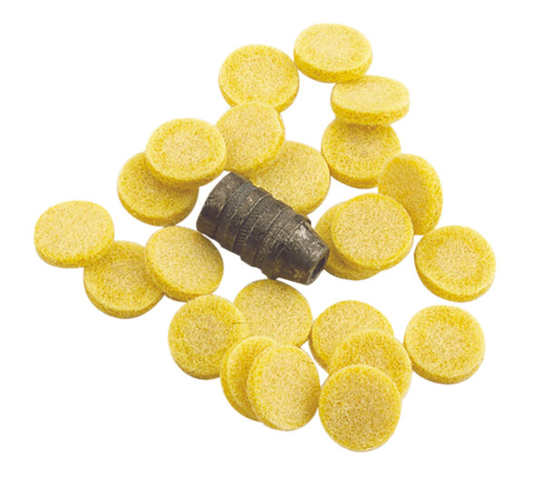 Yellow round tablets surrounding a gray object