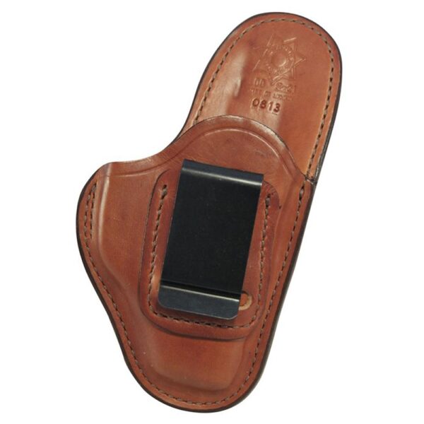 Leather holster with clip for carrying firearms.