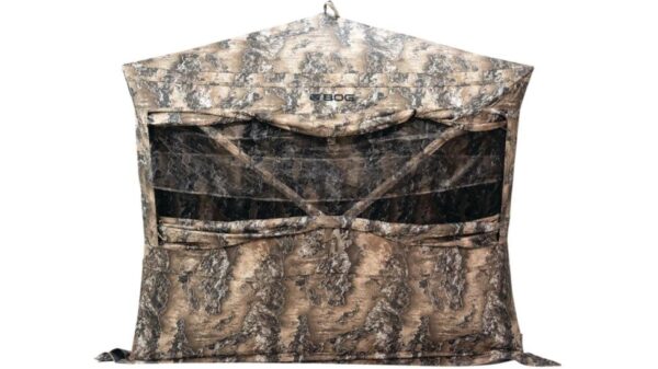 Camouflage hunting blind with mesh windows.