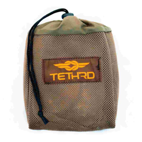 Brown mesh storage bag featuring TETHRD logo.