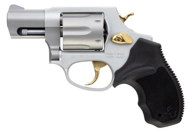 Silver revolver with black grip and gold accents.