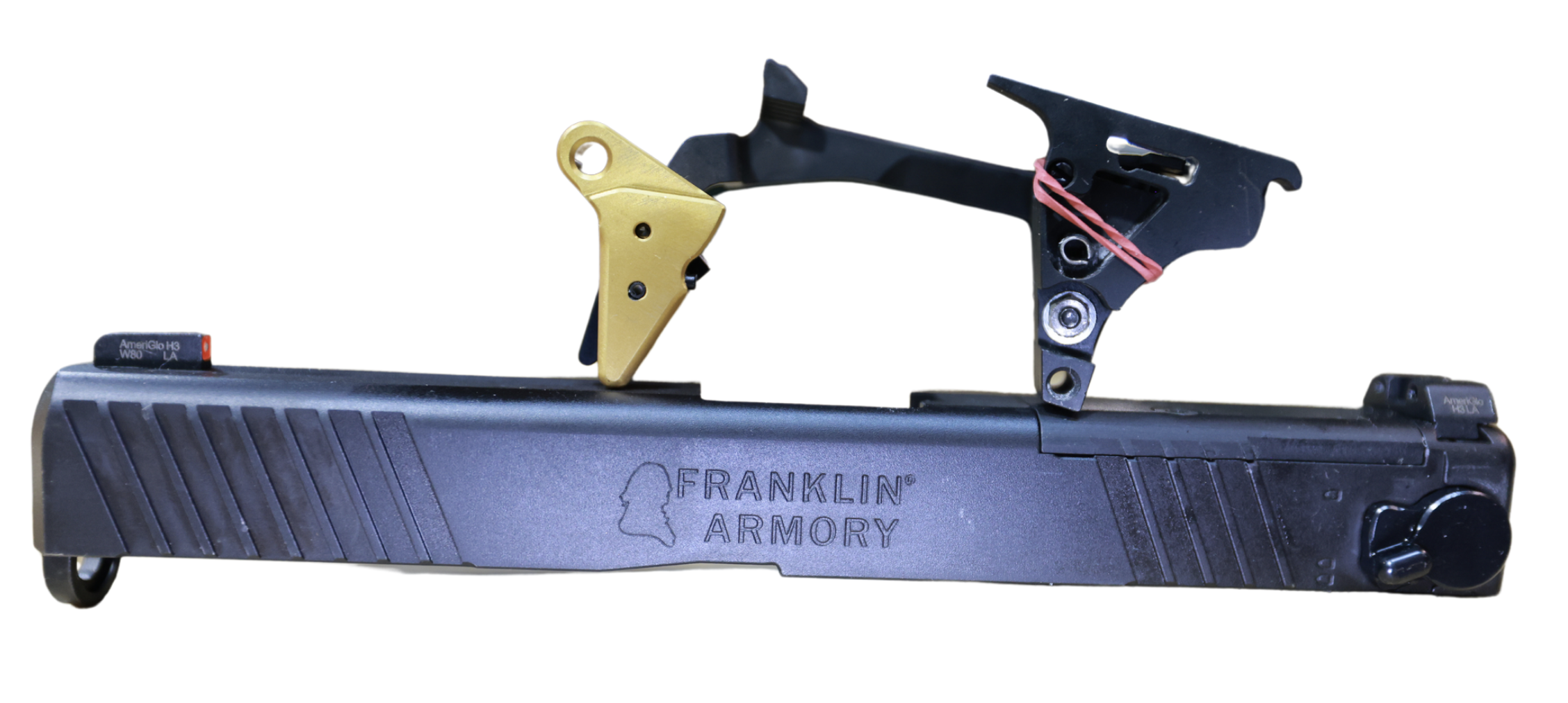 Franklin Armory firearm component with gold and black parts.
