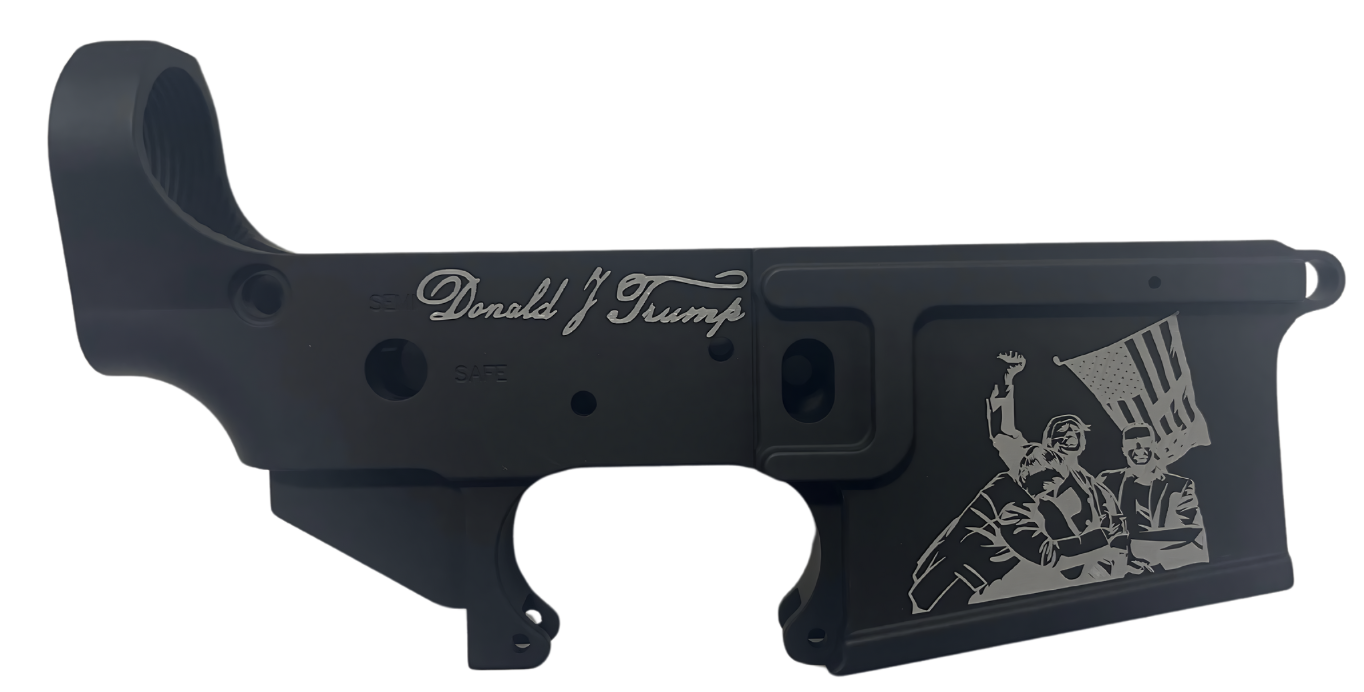 Black firearm receiver featuring Donald Trump engraving.