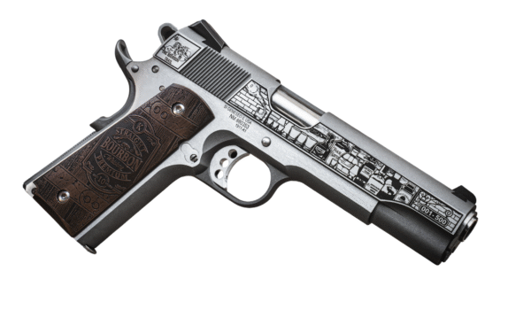 Decorative handgun with bourbon-themed engraving design.