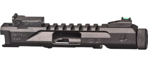 Black handgun slide with sight and rail.