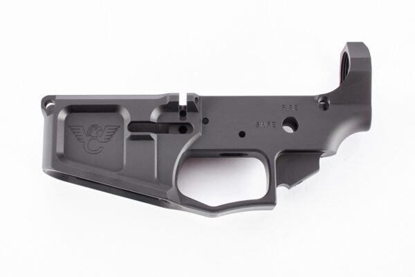 Machined firearm lower receiver part on white background.