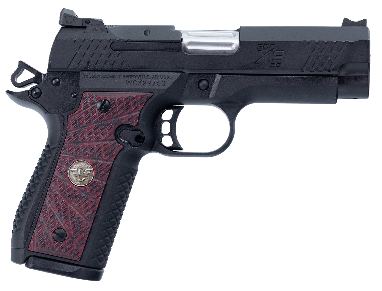 Black semi-automatic pistol with red grip.