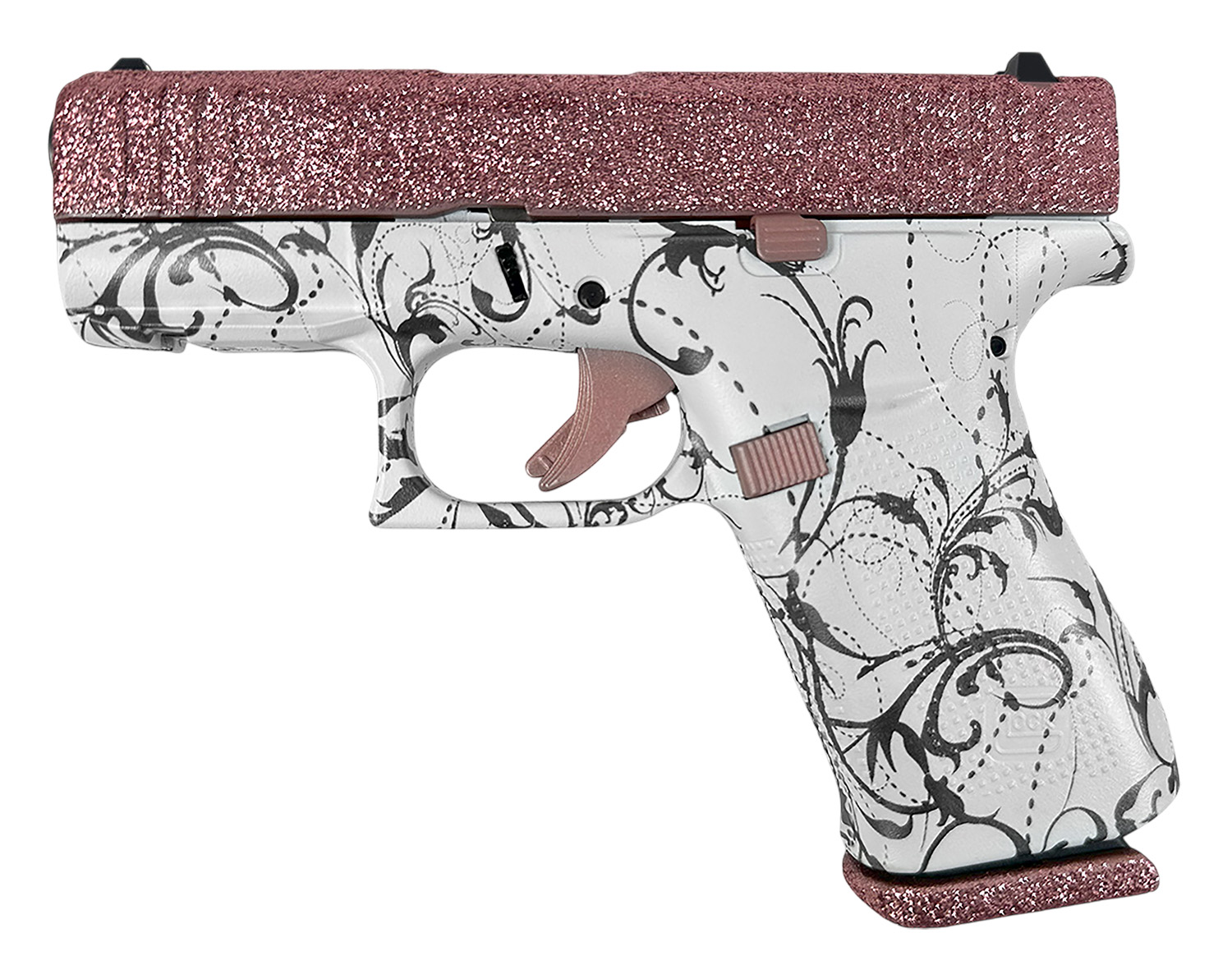 Decorative handgun with floral design and glitter