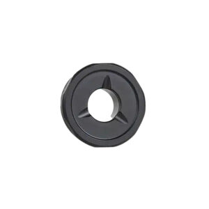 Black mechanical component with a central hole