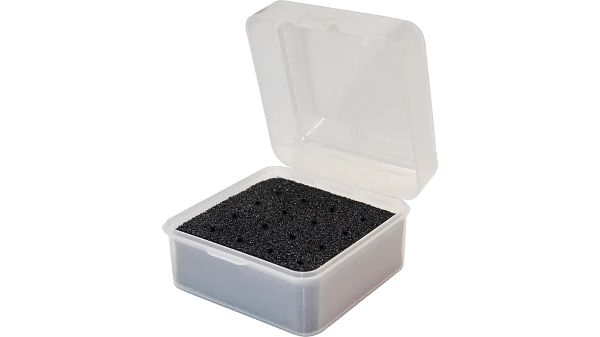 Black beads in a transparent plastic container.