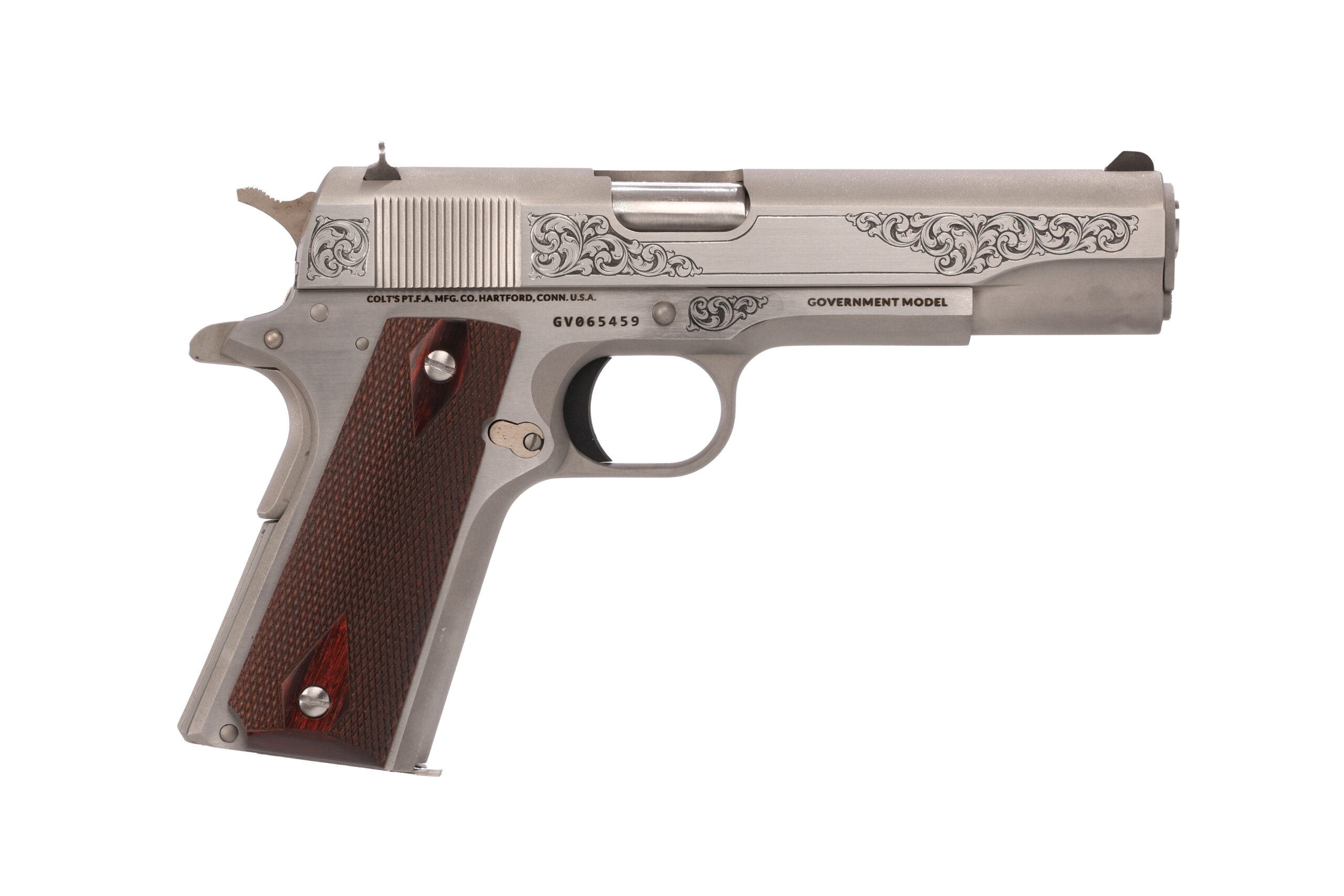 Silver handgun with ornate design and wood grip.