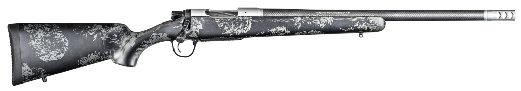 Decorative rifle with intricate black and silver design.