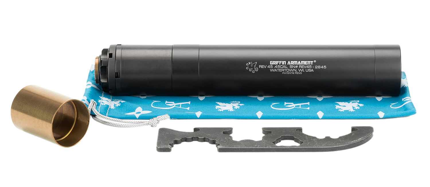 Black suppressor with tools on blue cloth