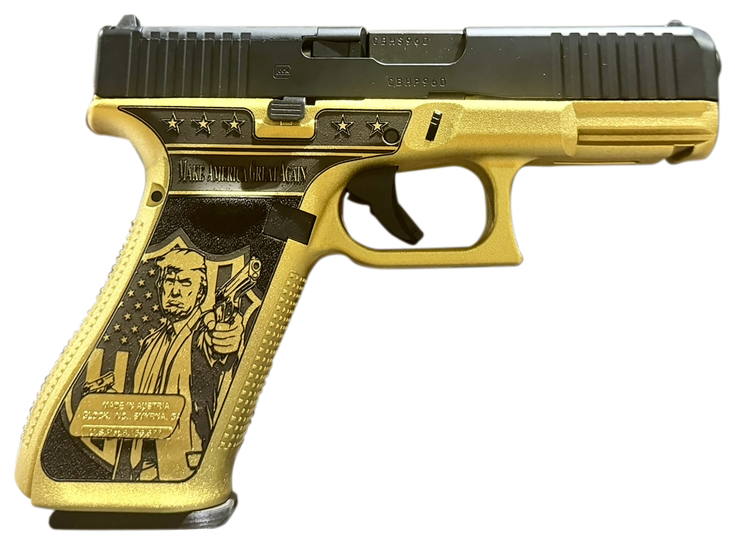 Gold handgun featuring a political design.