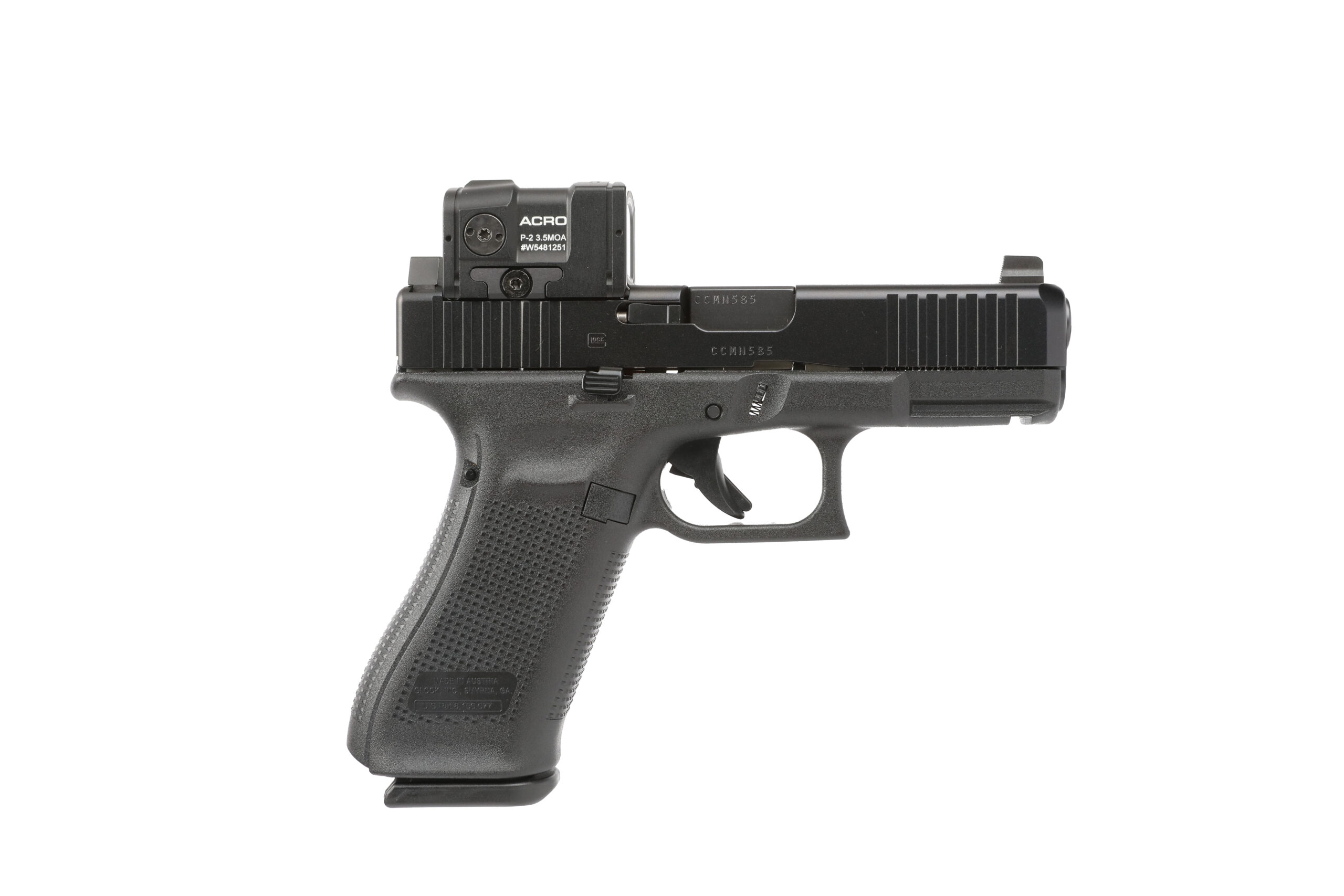 Black handgun with optical sight, side view.