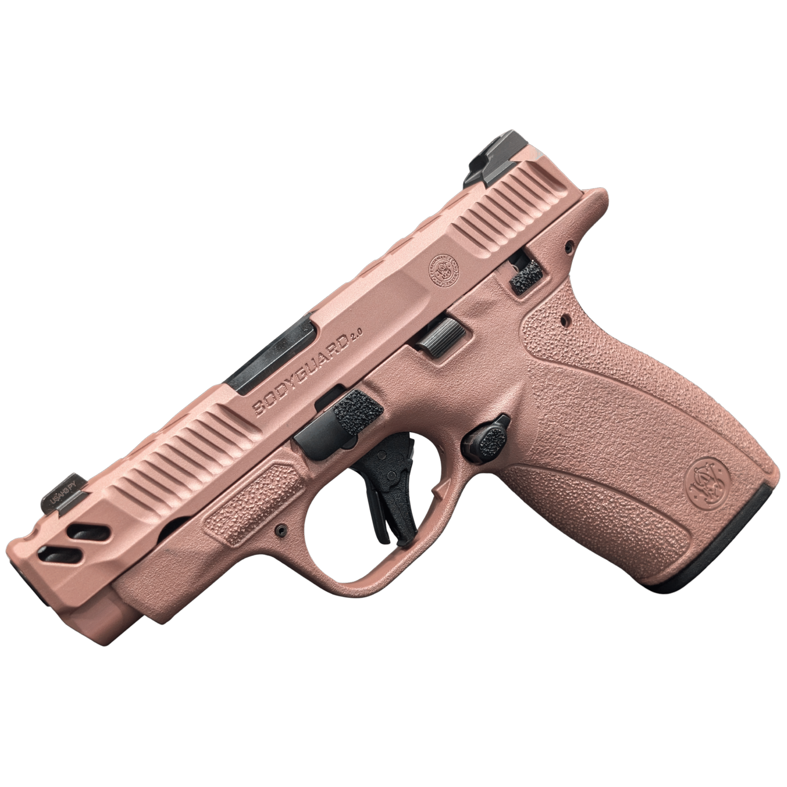 Rose gold compact handgun on a black background