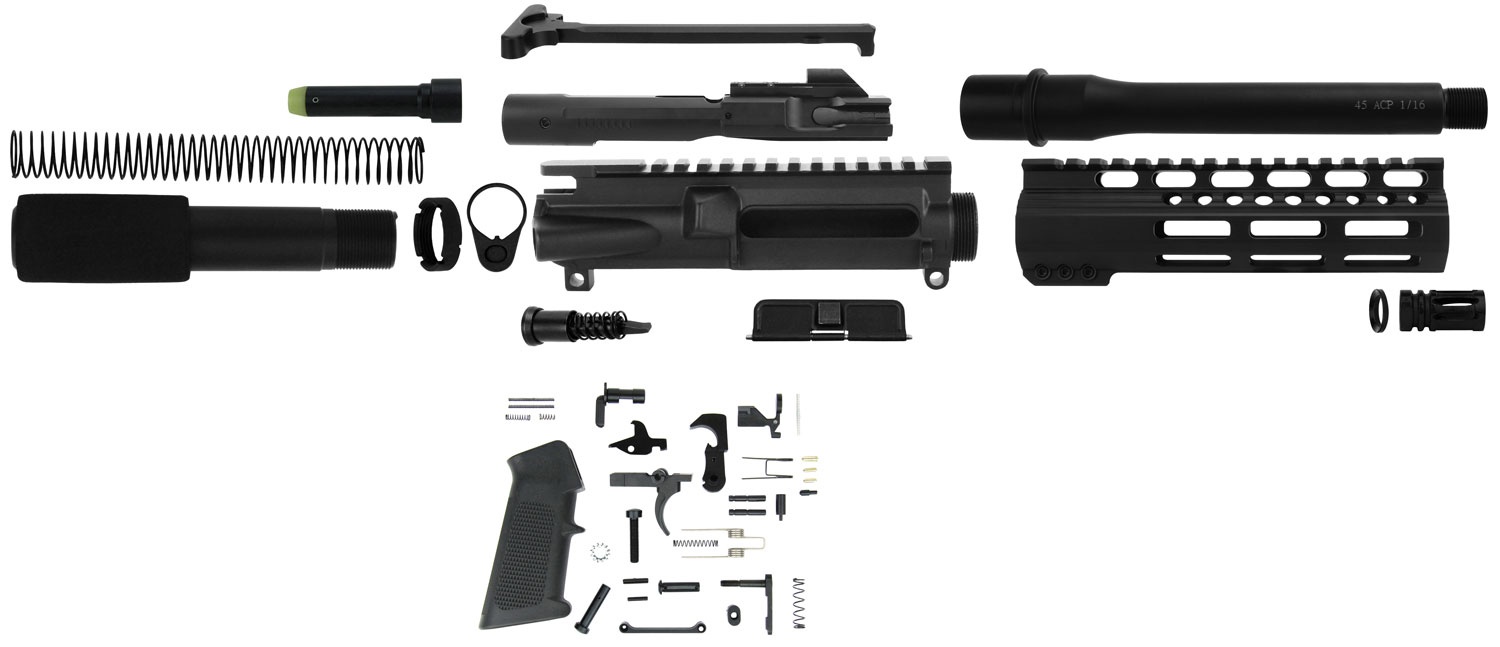 Disassembled rifle components arranged on a surface.