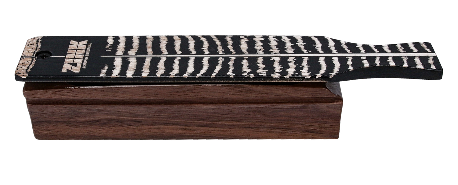 Wooden call with black striped surface.