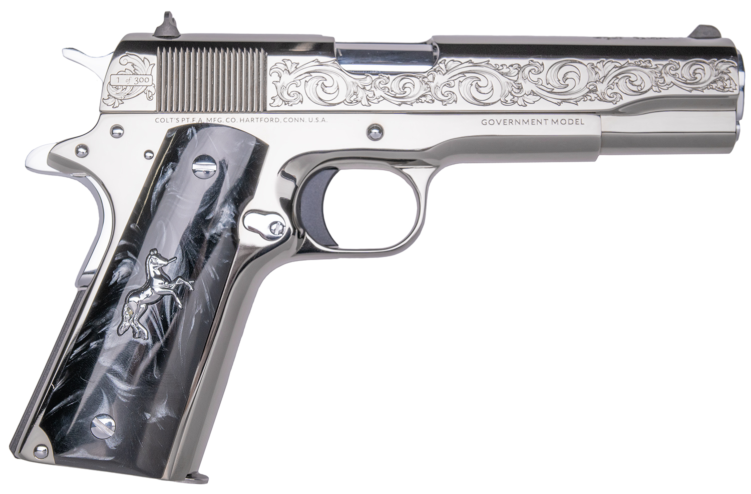Engraved stainless steel handgun with decorative grip
