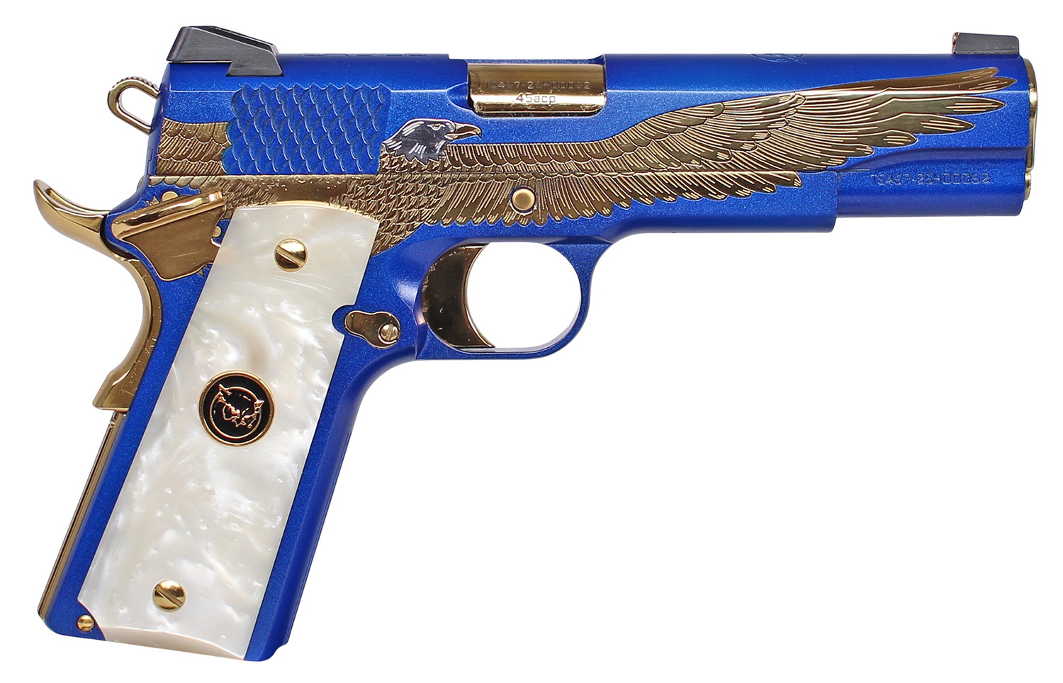 Blue and gold engraved handgun with white grip.