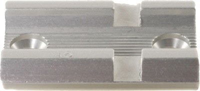 Aluminum component with grooves and holes.