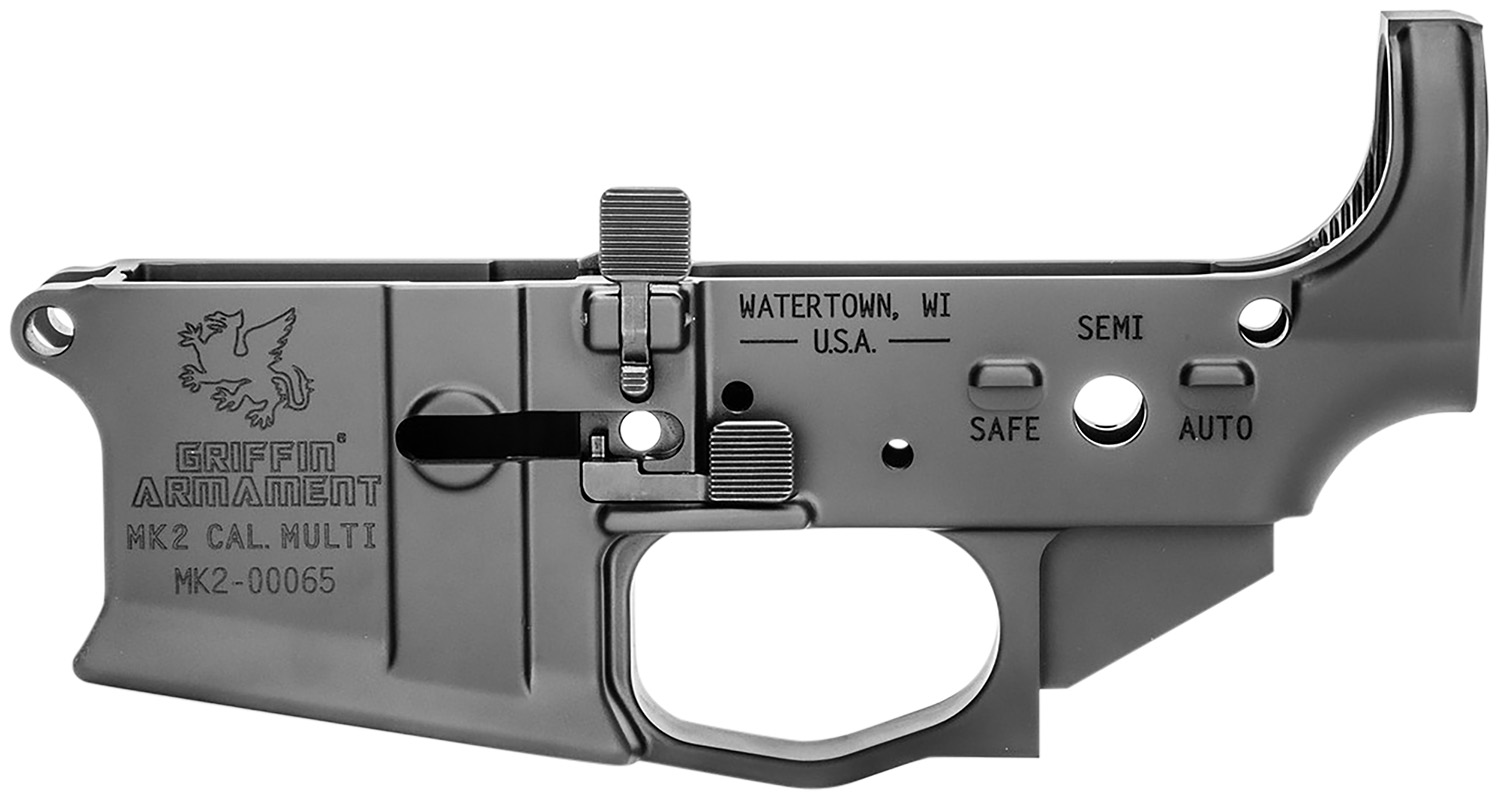 Gray firearm lower receiver with safety selector.