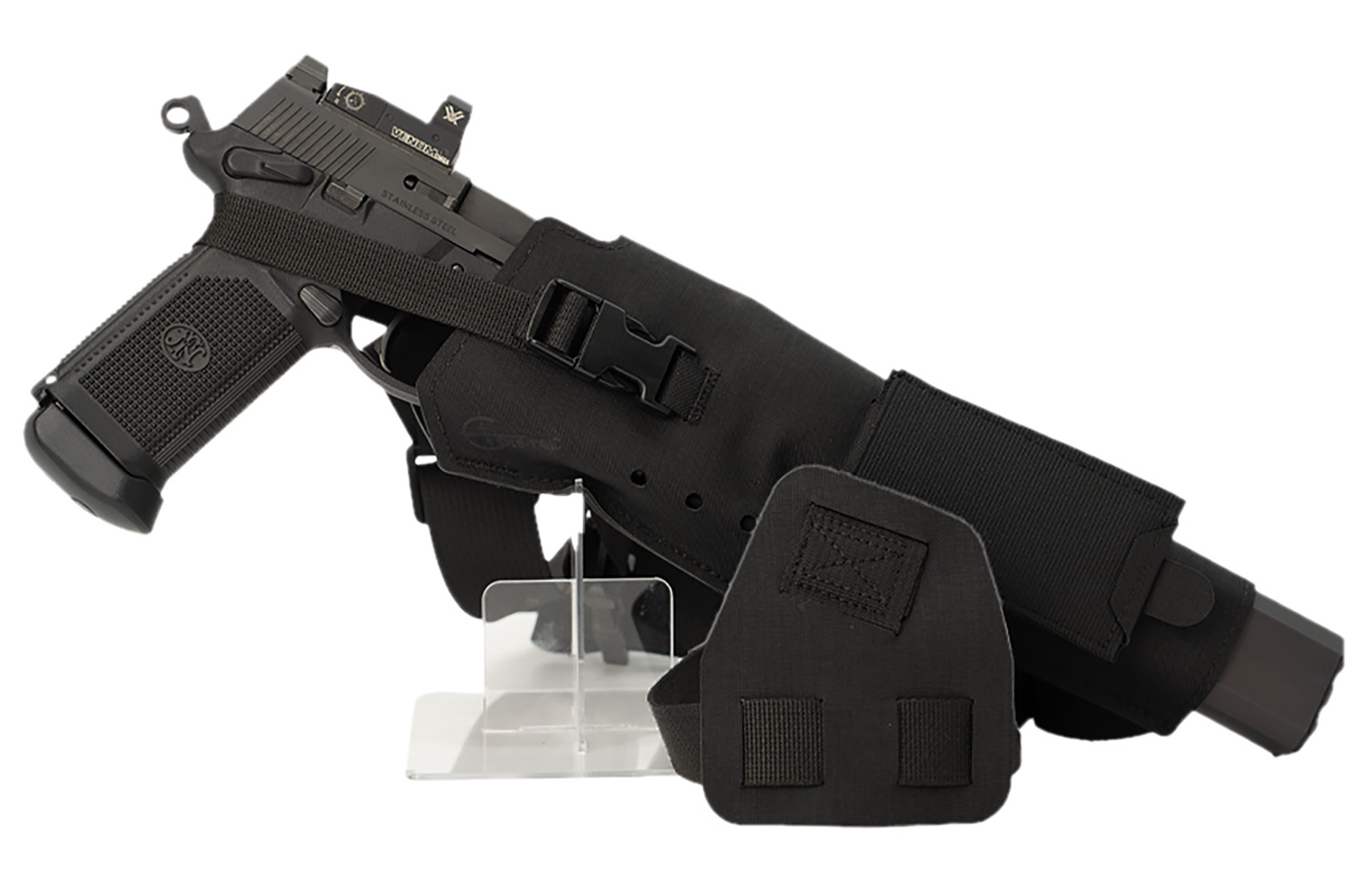 Handgun in tactical holster on display.