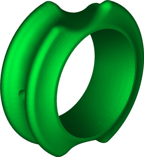 Green circular ring with grooves and hole.