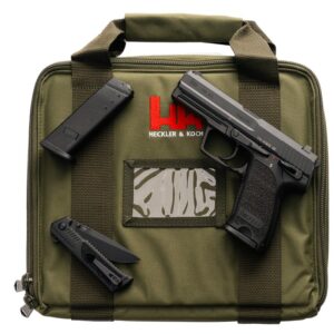 Heckler & Koch pistol with accessories on green bag.