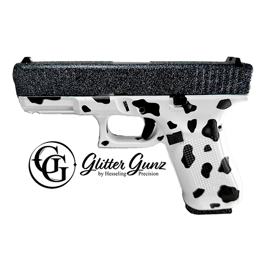 Stylized white handgun with cow print design.