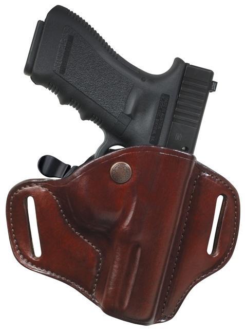 Black handgun in a brown leather holster