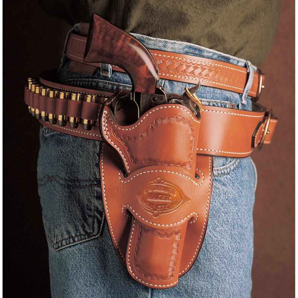 Leather holster with revolver on denim jeans