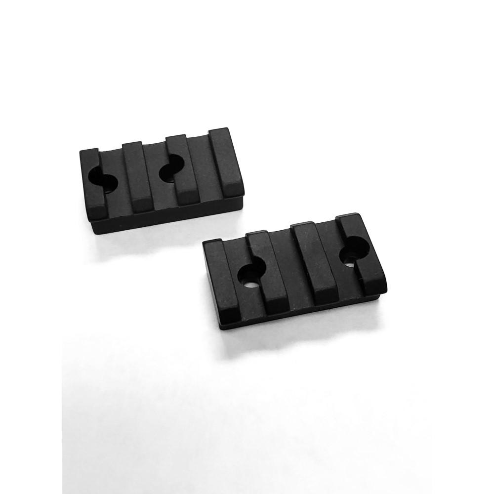 Two black tactical rail covers on white background.