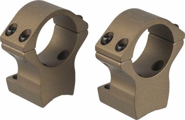 Brown scope rings for firearm mounting.